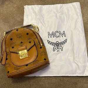 MCM mini tan MCM backpack with strap never used still has wrapping on it